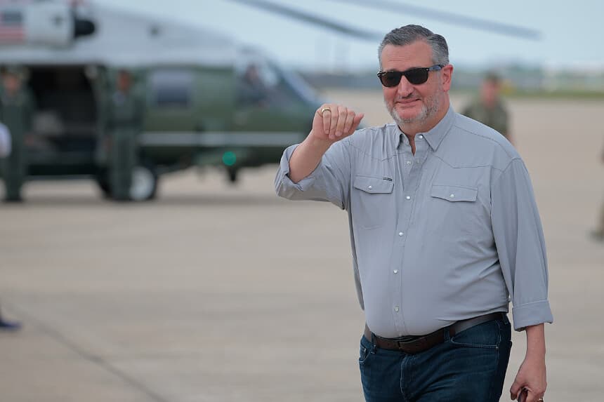 Sen. Ted Cruz (R-TX) waves as he arrives with President Donald Trump and first lady Melania Trump at Lackland Air Force Base before heading off to Kerrville, Texas where they plan to visit with state and local leaders, first responders and victims of last week's flash flooding on July 11, 2025 in San Antonio, Texas. Trump traveled to Texas one week after flash flooding along the Guadalupe River swept through cities, mobile home parks and summer camps, killing 120 people. Ninety-six of those killed were in Kerr County, where the toll includes at least 36 children. (Photo by Chip Somodevilla/Getty Images)