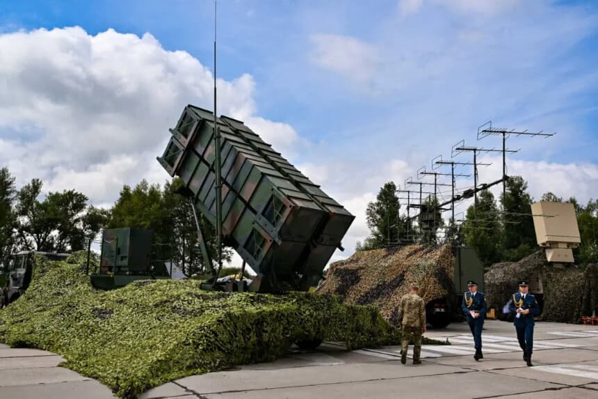 Ukrainian servicemen walk past a Patriot air defence system at an undisclosed area, on Aug. 4, 2024. Sergei Supinsky/AFP via Getty Images