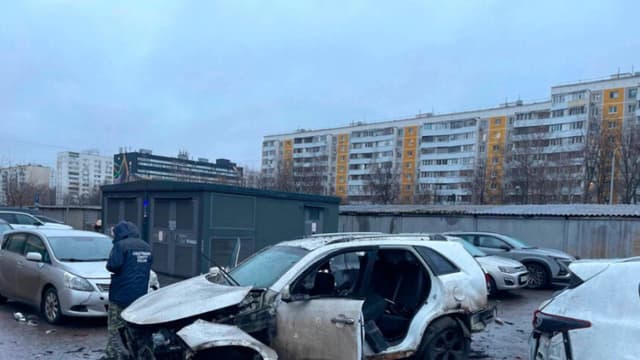 An investigator works at the scene where Lt. Gen. Fanil Sarvarov, head of the Operational Training Directorate of the Russian Armed Forces General Staff, was killed by an explosive device placed under his car in Moscow, in a photo provided by the Investigative Committee of Moscow on Dec. 22, 2025. Investigative Committee of Moscow via AP