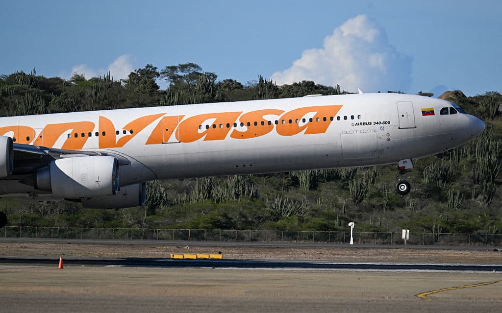 A Conviasa Airlines plane lands at Simon Bolivar International Airport in Maiquetia, Venezuela, on December 3, 2025. Venezuela announced on December 2, 2025, that it had reauthorized flights carrying migrants deported by the US, days after suspending them due to President Donald Trump's demand that Venezuelan airspace be considered "closed." (Photo by Juan BARRETO / AFP via Getty Images)