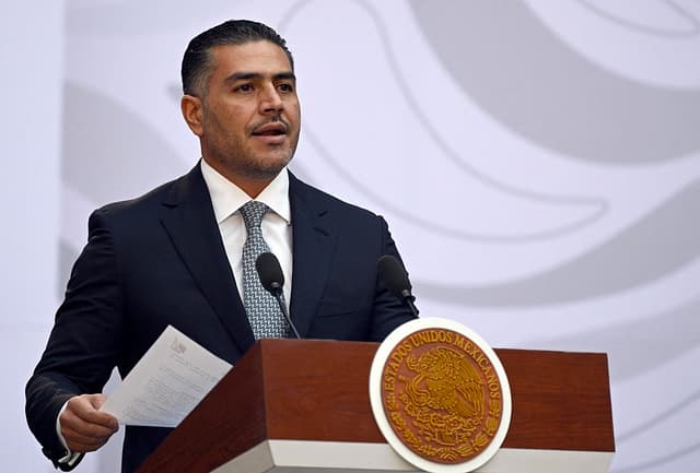Mexico's Secretary of Security and Civilian Protection Omar Garcia Harfuch speaks during the presentation of the Michoacan Plan for Peace and Justice at the National Palace in Mexico City on November 9, 2025. Claudia Sheinbaum's government announced on November 9, 2024, that it would reinforce the military presence and official authorities in the western state of Michoacan following the murder of a mayor that has outraged the whole of Mexico. (Photo by Alfredo ESTRELLA / AFP) (Photo by ALFREDO ESTRELLA/AFP via Getty Images)