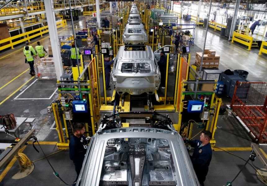 Workers assemble cars at the newly renovated Ford's Assembly Plant in Chicago, June 24, 2019. - The plant was revamped to build the Ford Explorer, Police Interceptor Utility and Lincoln Aviator. (Photo by JIM YOUNG / AFP)        (Photo credit should read JIM YOUNG/AFP via Getty Images)