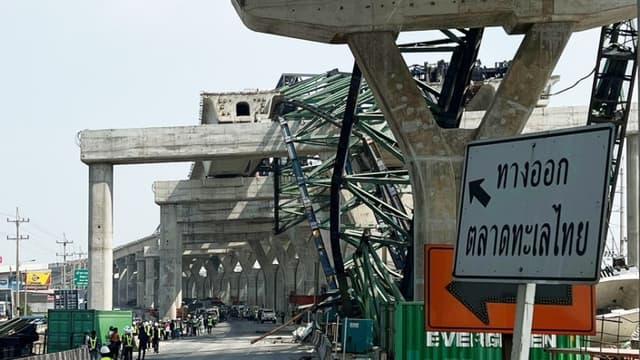 Equipos de emergencia en el lugar del accidente. (EFE/EPA/NARONG SANGNAK)