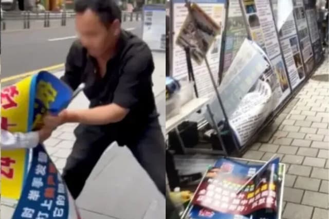 En una imagen fija de un video tomada en la isla de Jeju, Corea del Sur, el 2 de junio de 2026, un hombre vandaliza el puesto informativo de practicantes de Falun Gong. (Cortesía de practicantes de Falun Gong en Corea del Sur).